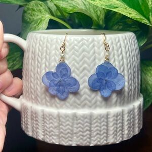 Handmade by me using real preserved flower and gold plated hooks.